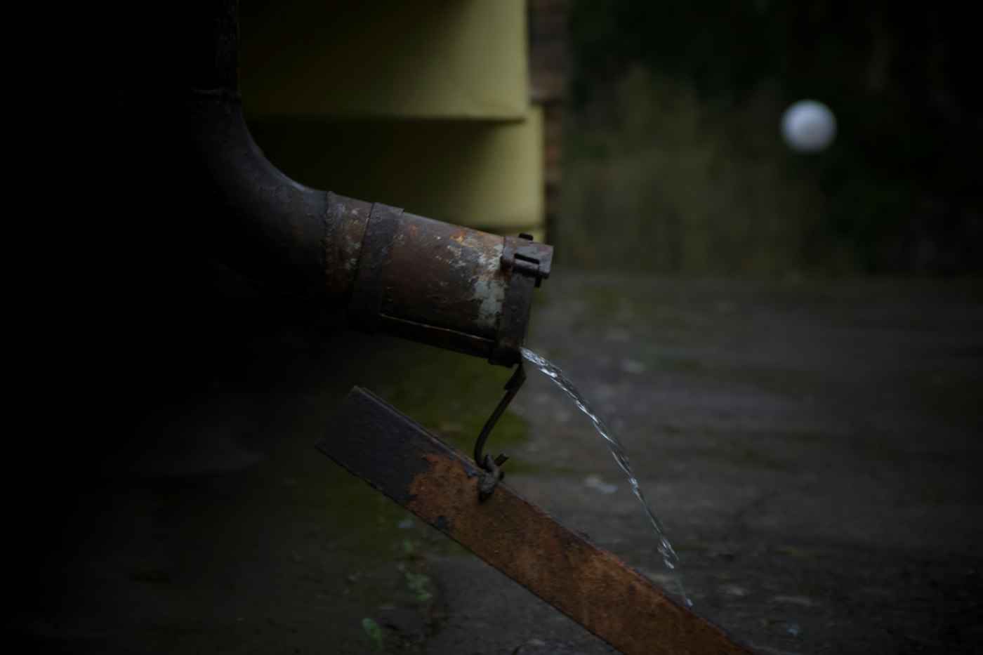 Water running from a worn downspout