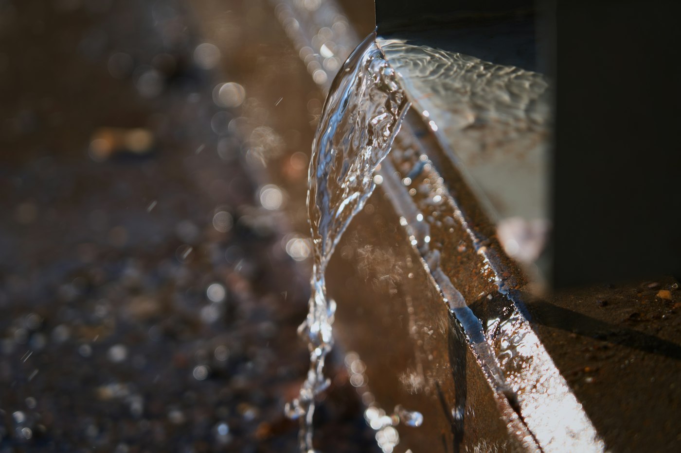 Rainwater pouring out of a gutter